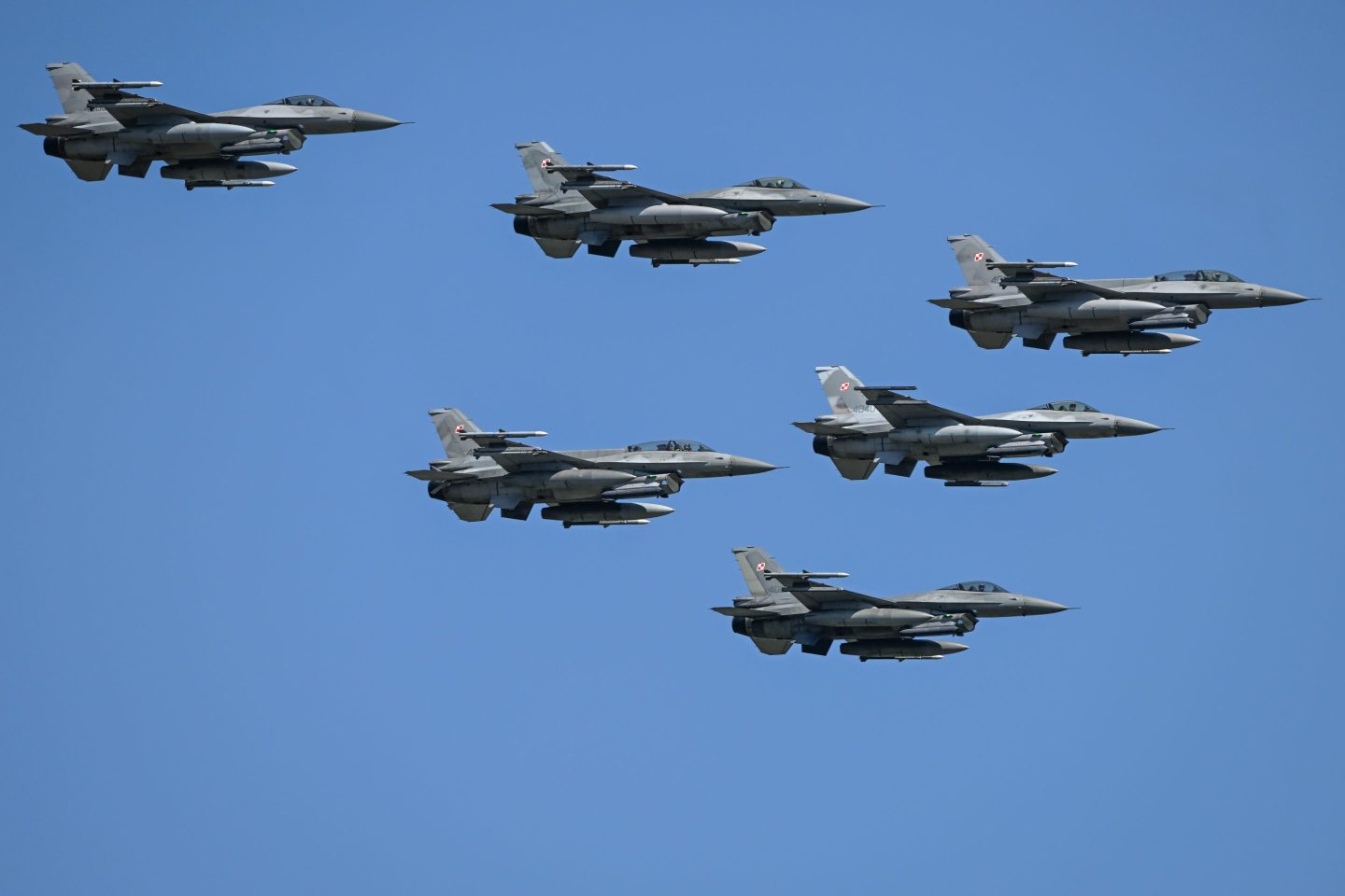 WARSAW, POLAND AUGUST 15:
A squadron of Polish Air Force F-16CJ Fighting Falcon jets soars over Warsaw during the Armed Forces Day parade, honoring Poland's 1920 victory over the Soviet Red Army and marking the 105th anniversary of the Battle of Warsaw, on August 15, 2025.
The event featured more than 4,000 Polish troops, about 200 soldiers from allied NATO nations, around 300 military vehicles, and nearly 50 aircraft, making it the largest parade in the country's history. (Photo by Artur Widak/NurPhoto via Getty Images)