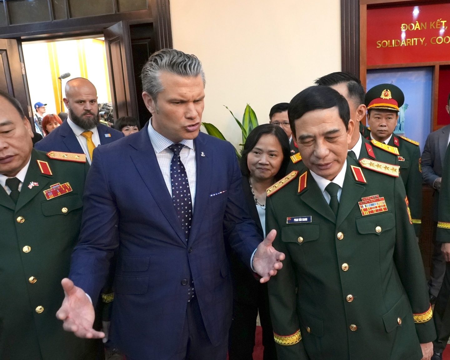 U.S. Defense Secretary Pete Hegseth speaks to Vietnamese Defense Minister Phan Van Giang before a meeting in Hanoi, Vietnam, Sunday, Nov. 2, 2025. (AP Photo/Hau Dinh)