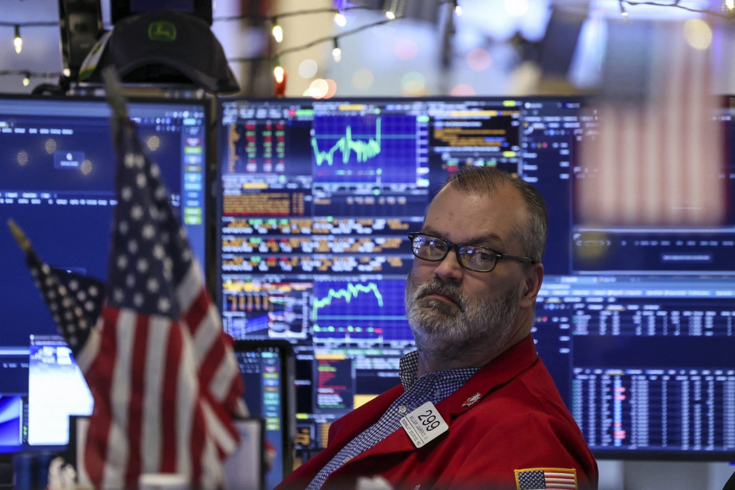 A trader works on the floor of the New York Stock Exchange (NYSE) after the opening bell in New York on January 2, 2026. Wall Street stocks mostly rose to start the new year on Friday, with some advances in tech while home goods stocks picked up too as President Donald Trump postponed planned tariff hikes. (Photo by ANGELA WEISS / AFP via Getty Images)