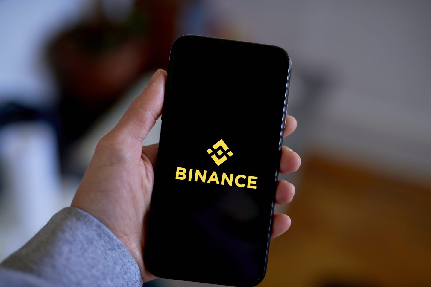 The Binance logo on a smartphone arranged in the Brooklyn borough of New York, US, on Tuesday, Feb. 14, 2023. The New York State Department of Financial Services said it had directed Paxos Trust Co. to stop issuing new tokens of crypto's third largest stablecoin, a Binance-branded coin known as BUSD that has roughly $16 billion in circulation. Photographer: Gabby Jones/Bloomberg via Getty Images