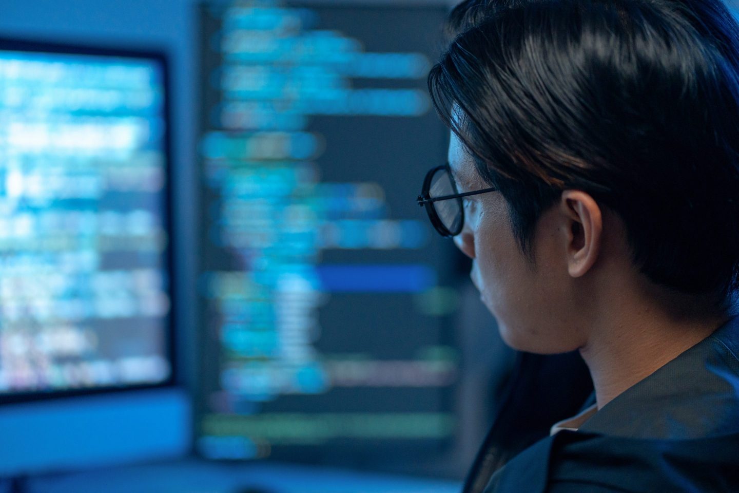 Close up shot of Modern IT crime: a hacker uses spyware to leak confidential data, posing a serious threat to network security.