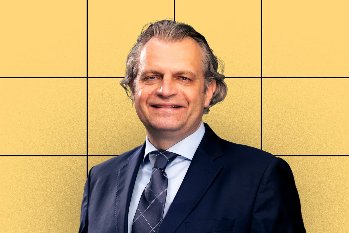 Photo of Daniel Diermeier over a gold background with a black grid.