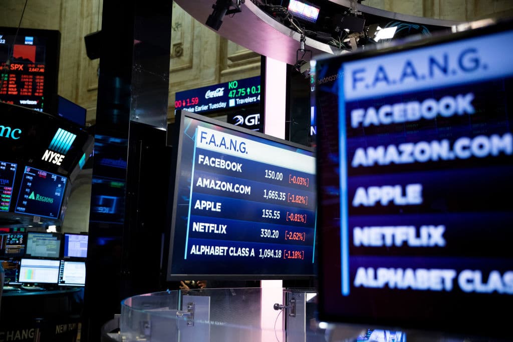 Monitors display FAANG stock information on the floor of the New York Stock Exchange (NYSE) in New York, as seen in January 2019. (Photographer: Michael Nagle—Bloomberg/Getty Images)