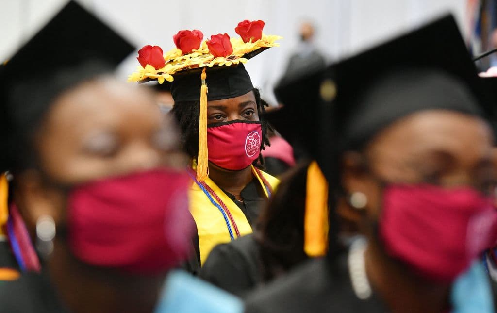 Students attend their graduation ceremony at South Carolina State University, as seen in December 2021, in Orangeburg, South Carolina. (Photo by Mandel Ngan—AFP/Getty Images)