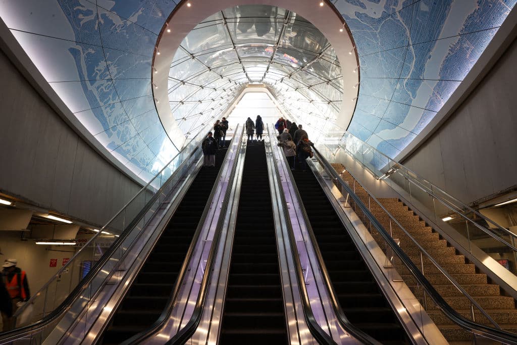 People are seen at the Penn Station in New York City, as seen in February 2022. (Photo by Tayfun Coskun—Anadolu Agency/Getty Images)