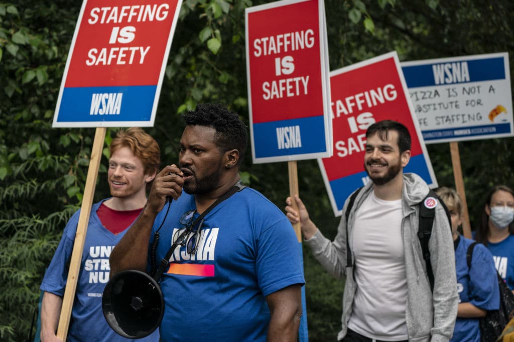 Nurses and supporters rally for better working conditions outside the Seattle Children's Hospital in Seattle, Washington, as seen in August 2022. (Photographer: David Ryder—Bloomberg/Getty Images)