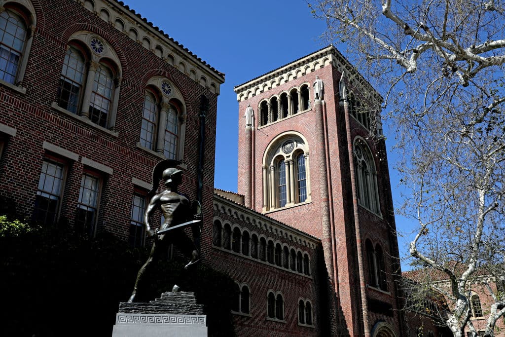 Bovard Administration Building with Tommy Trojan on the campus of the University of Southern California, as seen in March 2023 in Los Angeles. (Photo by Gary Coronado—Los Angeles Times/Getty Images)