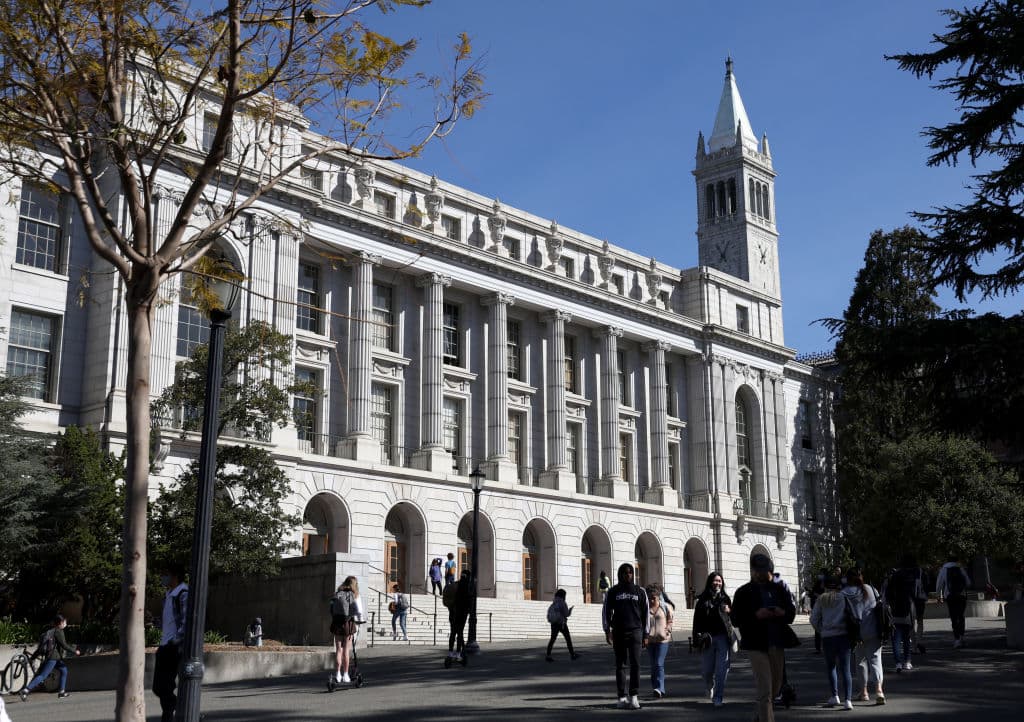 People walk by Wheeler Hall on the UC Berkeley campus, as seen in March 2022 in Berkeley, California. (Photo by Justin Sullivan/Getty Images)