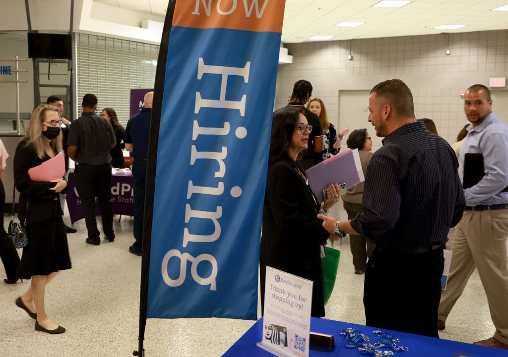 People attend the Mega Job Fair held at the FLA Live Arena, as seen in June 2022 in Sunrise, Florida. (Photo by Joe Raedle/Getty Images)