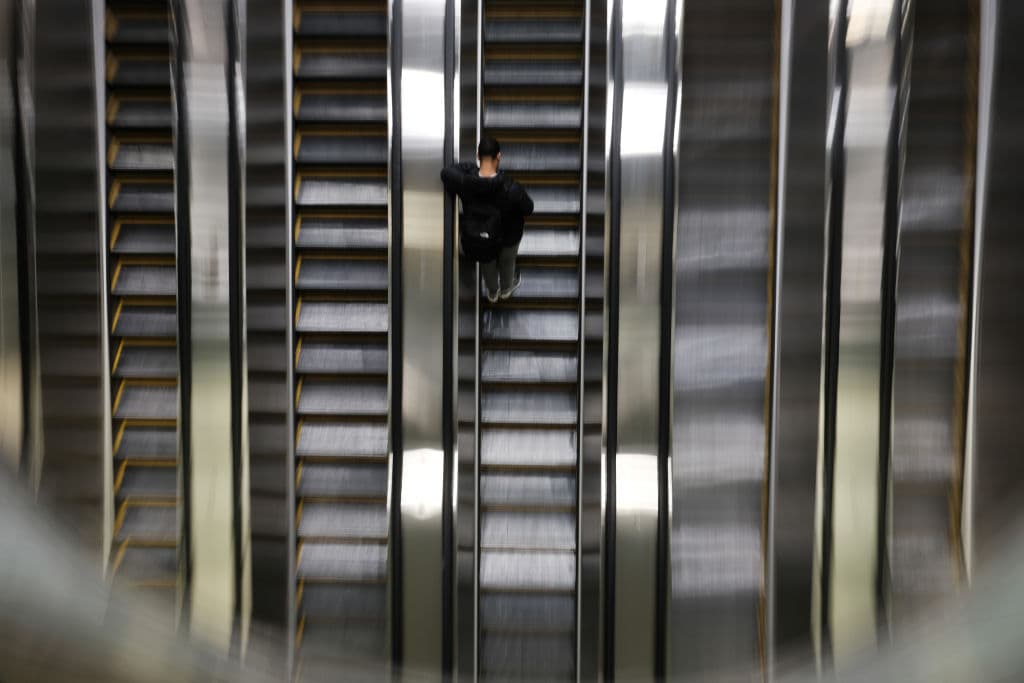 People ride the escalator in the newly opened Grand Central Madison train terminal, as seen February 2023 in New York City. (Photo by Spencer Platt/Getty Images)
