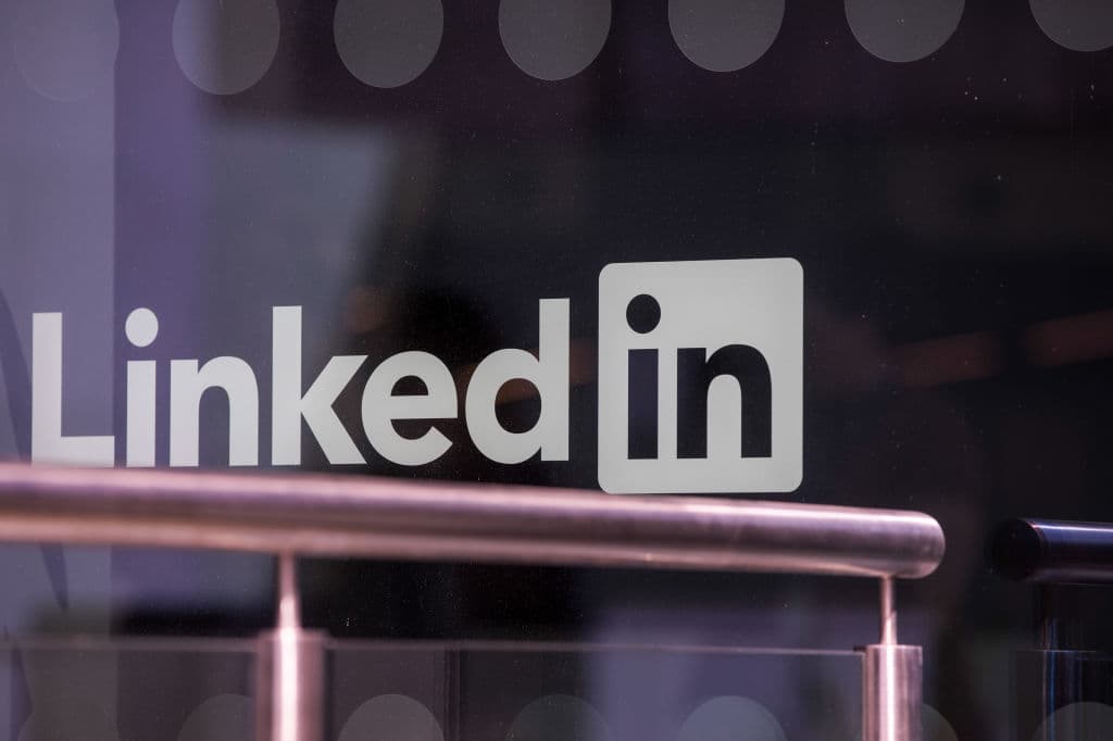 A logo sits on the window of the LinkedIn Corp. European headquarters in Dublin, Ireland, as seen in June 2018. (Photographer: Jason Alden—Bloomberg/Getty Images)