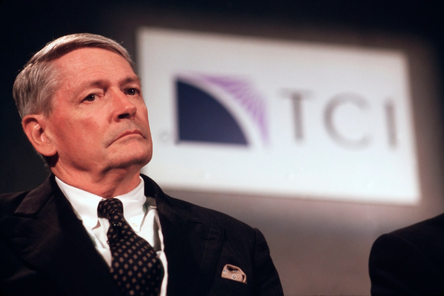 John Malone, CEO of TCI, at a press conference announcing the AT&T merger.