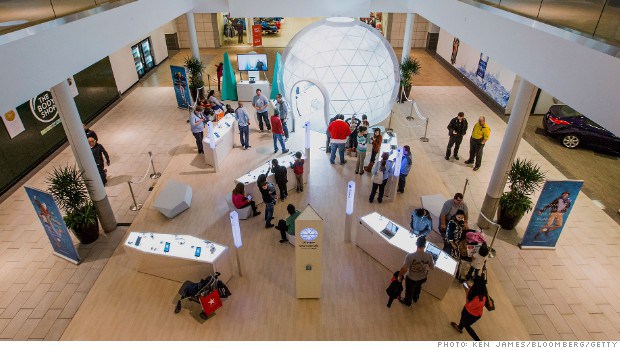 Shoppers view Google produces at the Google's new temporary Winter Wonderlab inside the Roseville Galleria, in Roseville California U.S., on Saturday, December. 14, 2013. Google has set up 6 temporary Winter Wonderlabs across the country were shoppers can view google produces and create slow motion video. Photographer: Ken James/Bloomberg