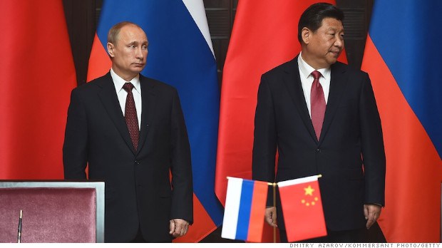 CHINA, SHANGHAI - MAY 20: (L to R) Meeting of the president of Russia Vladimir Putin and the Chinese President Xi Jinping at the Expo Center at the fourth Conference on Interaction and Confidence Building Measures in Asia (CICA) summit on May 20, 2014 in Shanghai, China. Russia and China signed the thirty-year contract for supply of gas. (Photo by Dmitry Azarov/Kommersant Photo via Getty Images) *** Local Caption *** Vladimir Putin;Xi Jinping