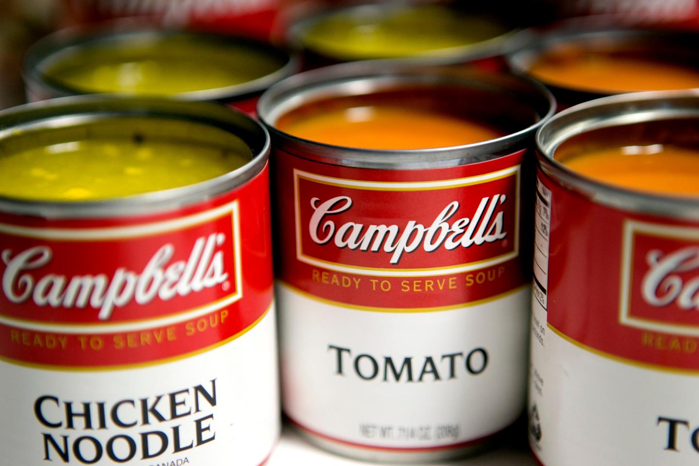 Cans of Campbell Soup Co. Campbell's chicken noodle and tomato soup are arranged for a photograph in Washington, D.C., U.S., on Monday, Nov. 19, 2012. Campbell Soup Co. is scheduled to release earnings data on Nov. 20. Photographer: Andrew Harrer/Bloomberg via Getty Images