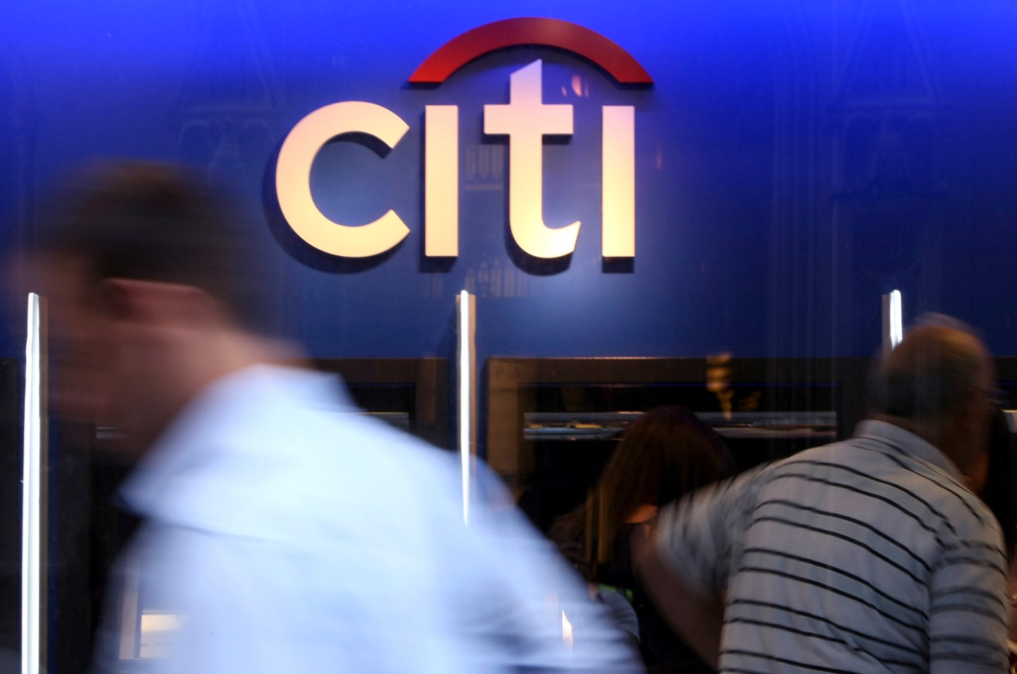 Pedestrians pass a Citigroup Inc. bank branch in New York.