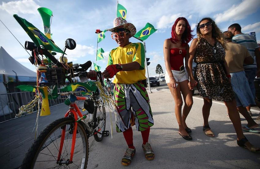 A Brazil fans stands outside of opening ceremony rehearsals around Itaquerao stadium