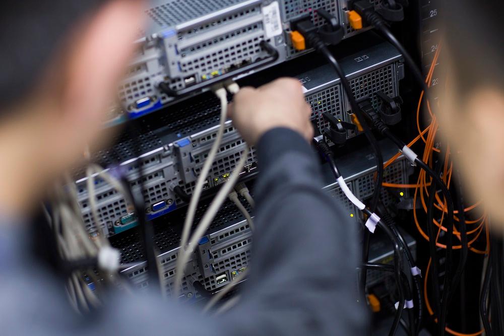 Technicians doing maintenance in computer room