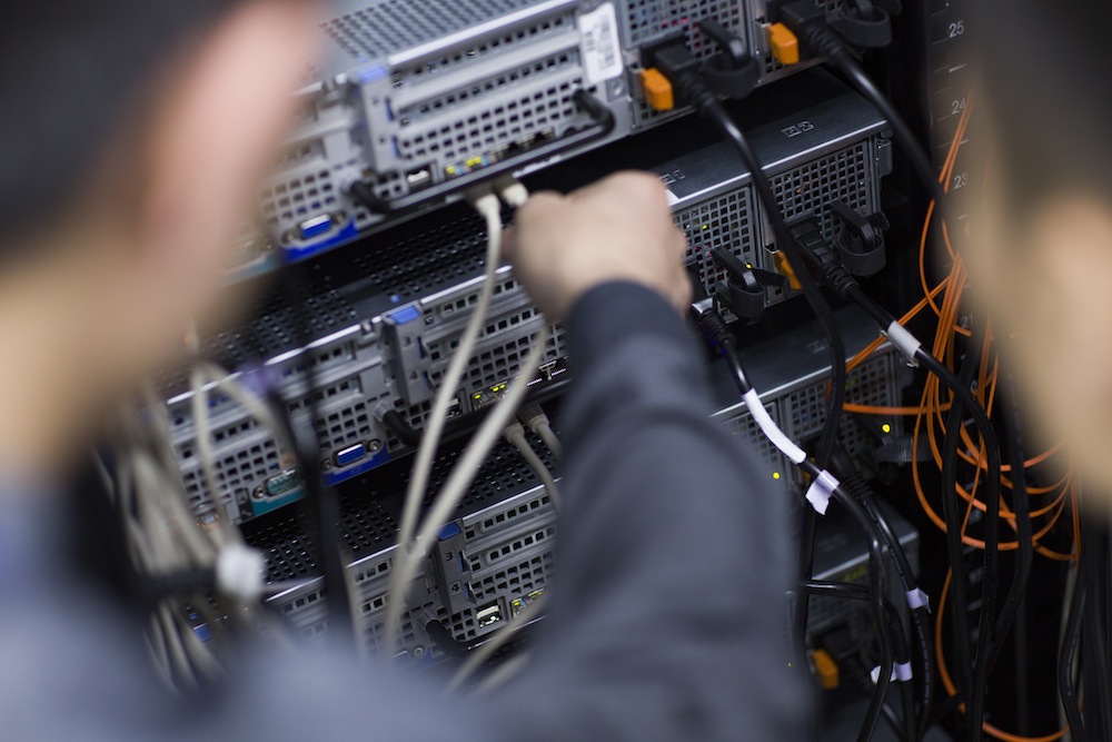 Technicians doing maintenance in computer room