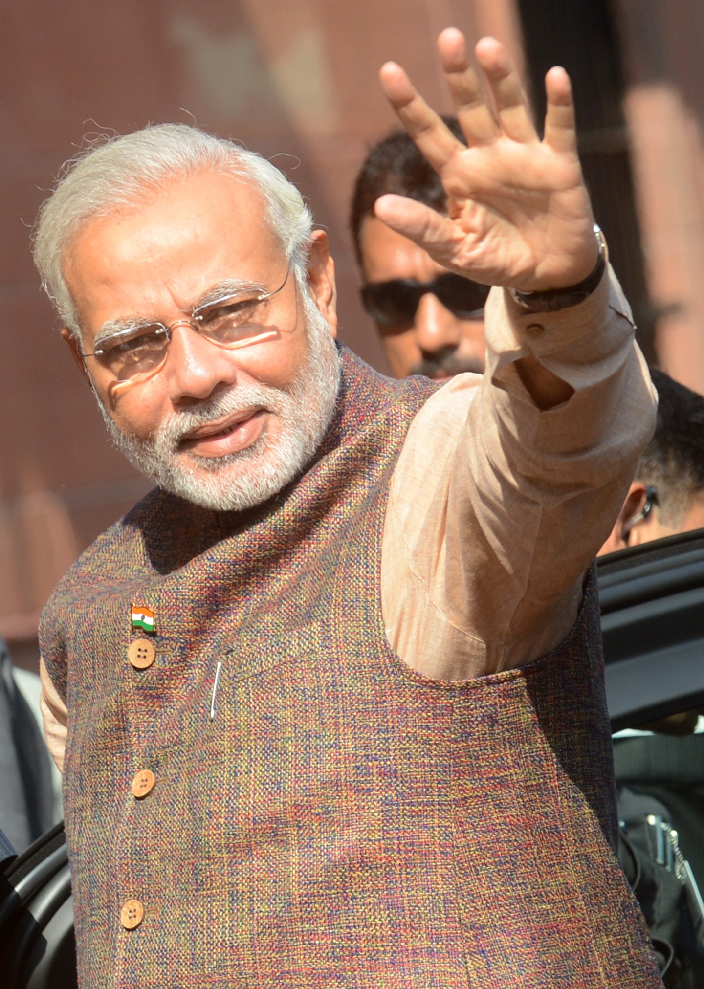 India's new Prime Minister Narendra Modi gestures during his arrival at the Prime Minister's Office at South Block in New Delhi on May 27, 2014. 