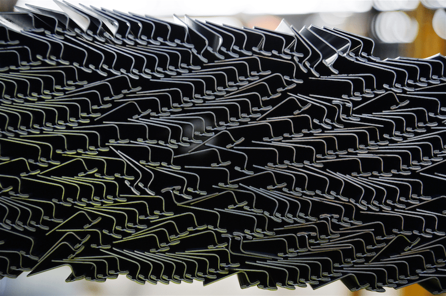 Metal rods sit in a pile awaiting shaping on the production line at the Backwell IXL plant in Geelong, Australia, on Tuesday, May 20, 2014.