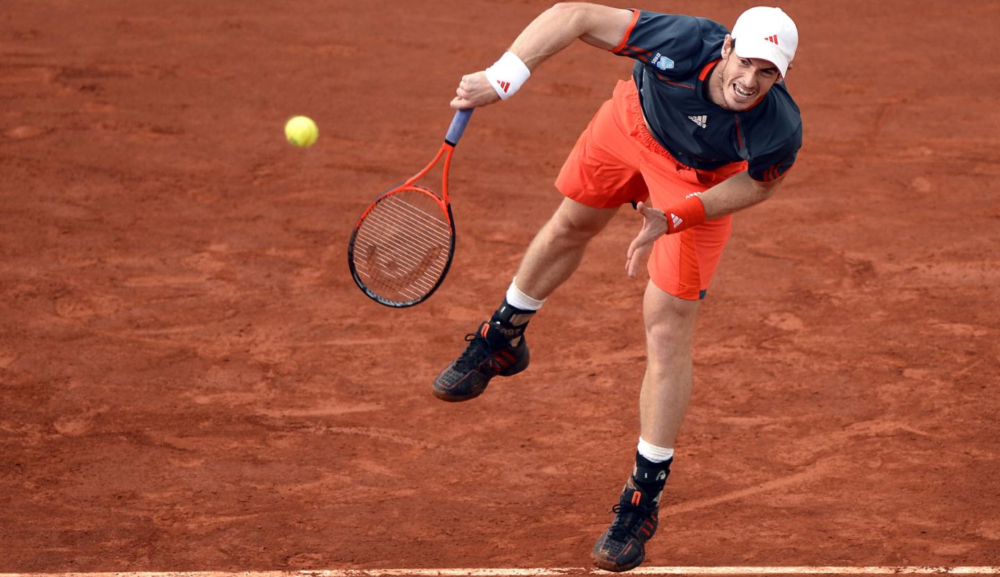 Britain's Andy Murray serves to Spain's