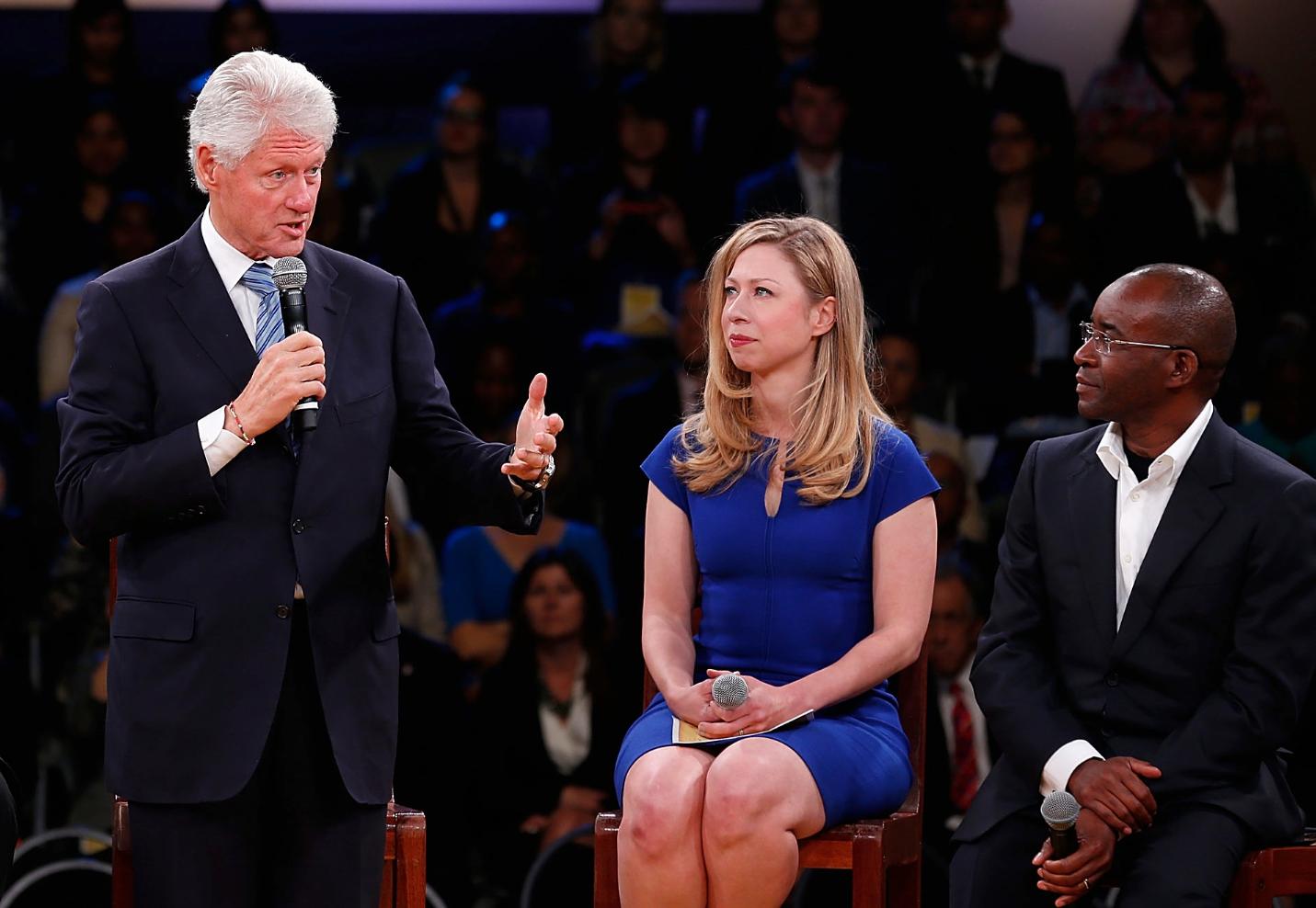 Former U.S. president Bill Clinton, left.