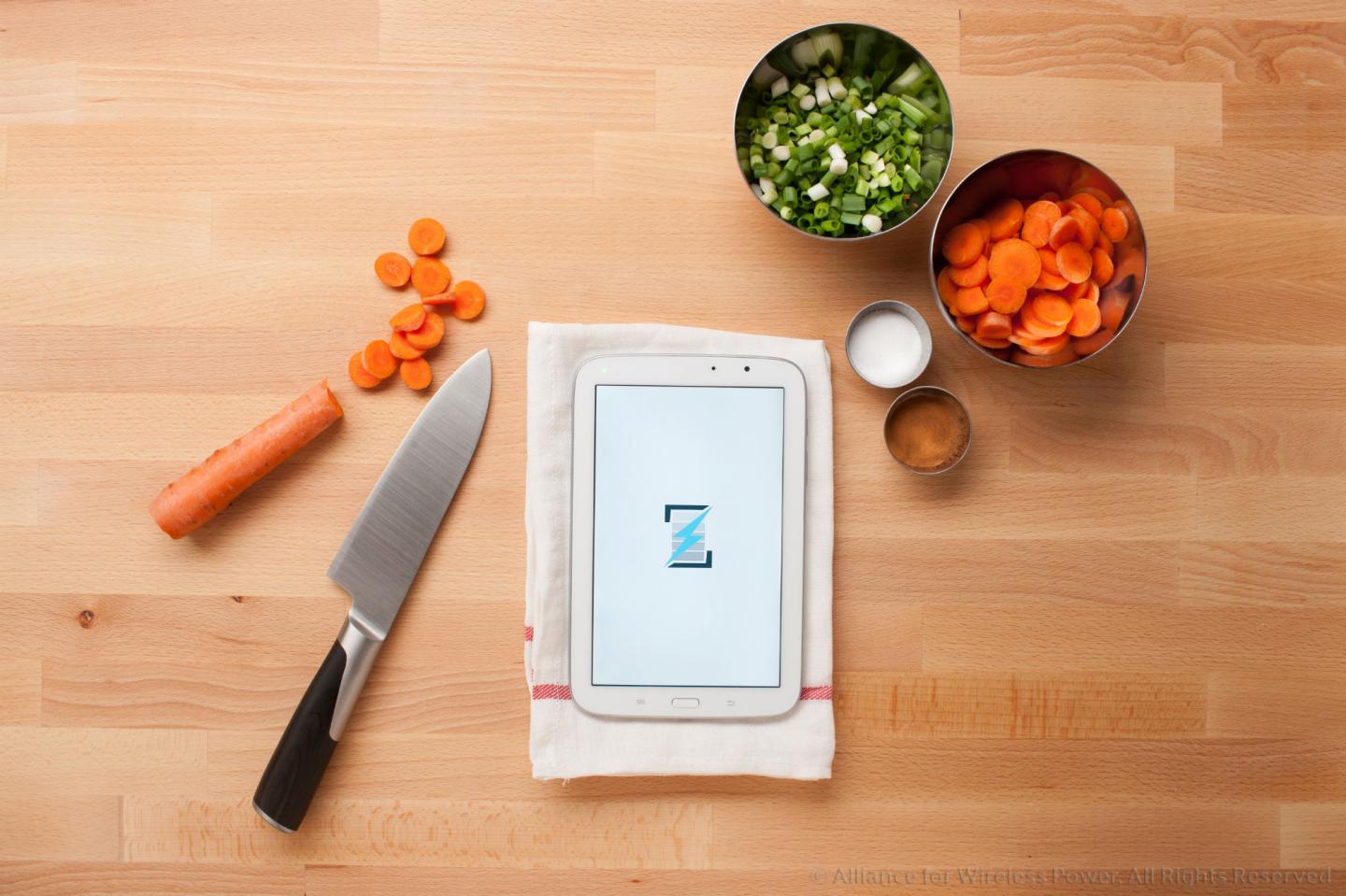 A conceptual photograph of Rezence, a next-generation wireless charging technology that uses magnetic resonance to transfer energy.