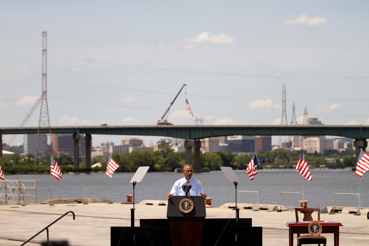 U.S. President Barack Obama on July 17, 2014 announces new national infrastructure initiative at the Port of Wilmington, Delaware, in front of the I-495 Bridge, which is undergoing substantial structural repairs.
