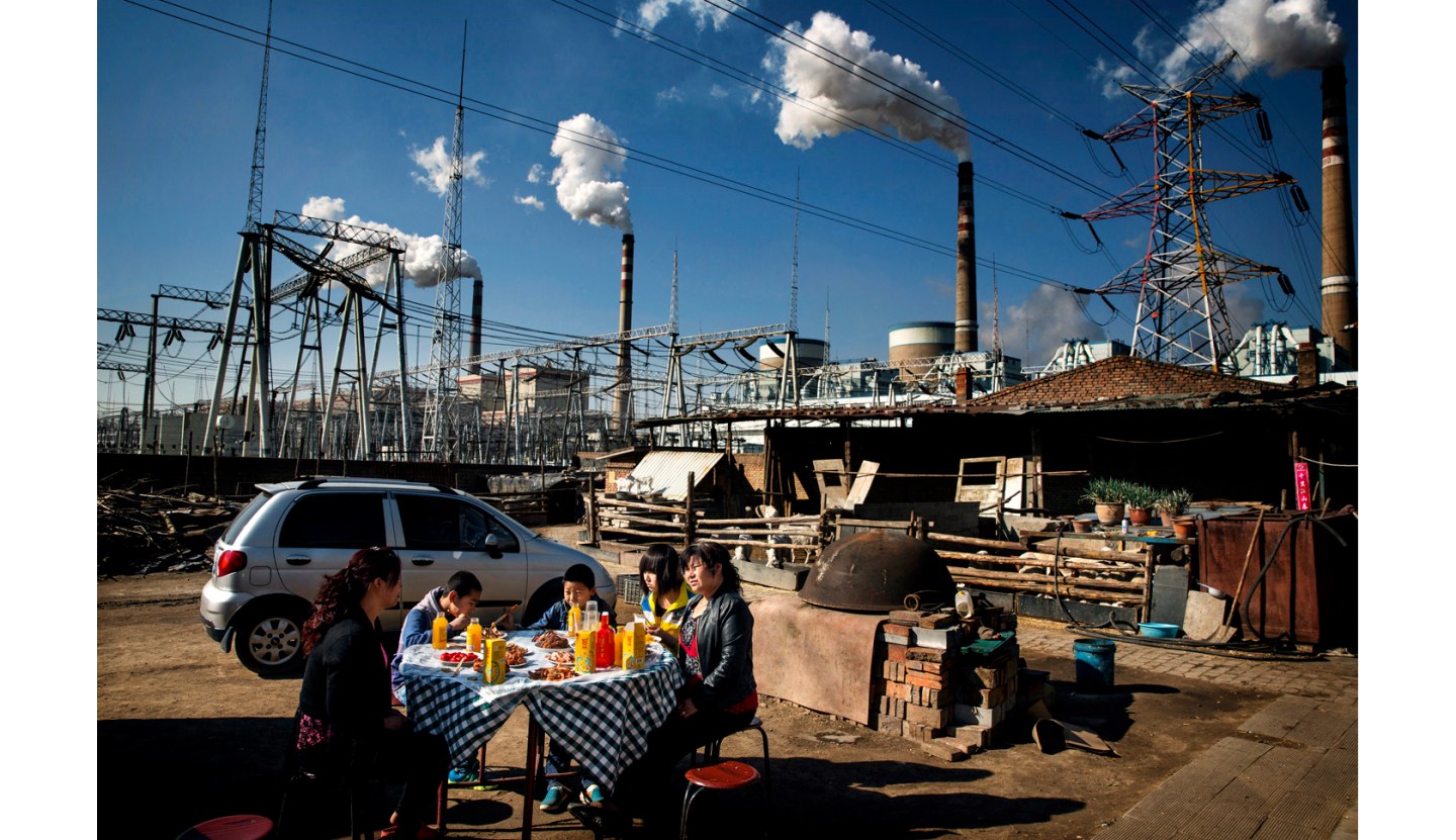 family eating near Datong No. 2 coal-fired power plant