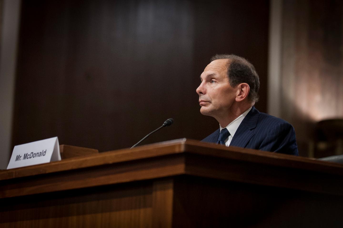 Caption:Robert 'Bob' McDonald, former chief executive officer of Procter &amp; Gamble Co., listens while testifying during a nomination hearing before the Senate Veterans Affairs Committee in Washington, D.C., U.S., on Tuesday, July 22, 2014. McDonald said he'd use the skills he developed during three decades in the private sector to overhaul the troubled U.S. Department of Veterans Affairs. Photographer: Pete Marovich/Bloomberg via Getty Images
