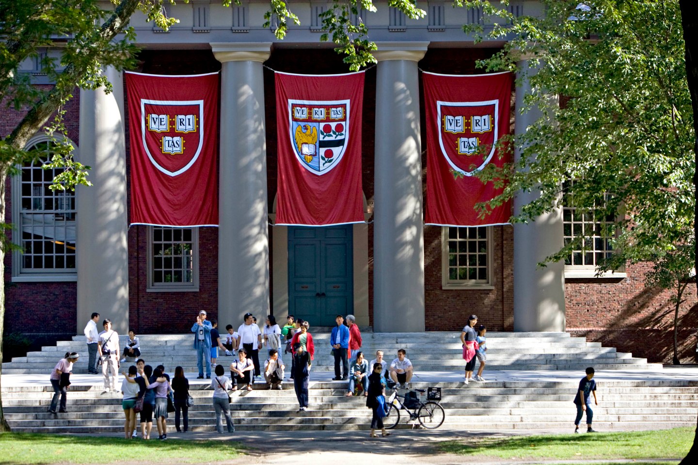 Harvard banners hang outside Memorial Church on the Harvard