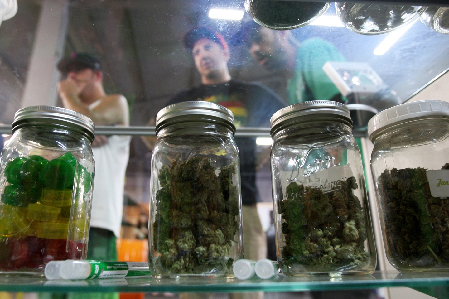 People look at jars of marijuana at the medical marijuana farmers market in Los Angeles