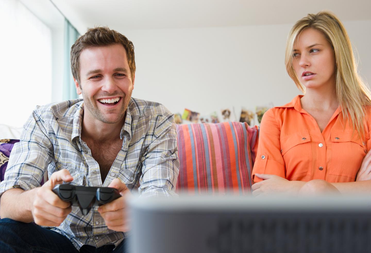 Girlfriend mad at boyfriend playing video game