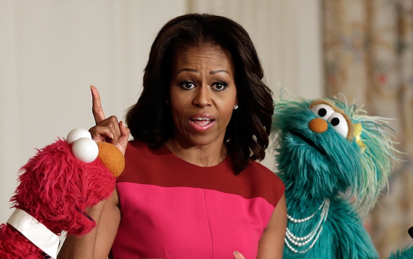 First Lady Michelle Obama with Sesame Street's Elmo (L) and Rosalita (R) announces an initiative aimed at promoting healthier nutrition for school children