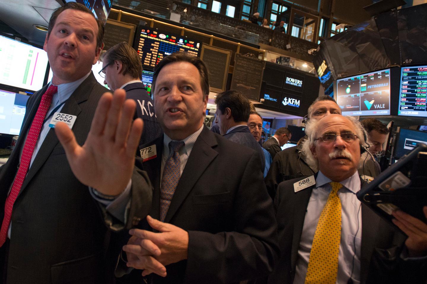 Traders work on the floor before the NYSE Opening Bell in New York