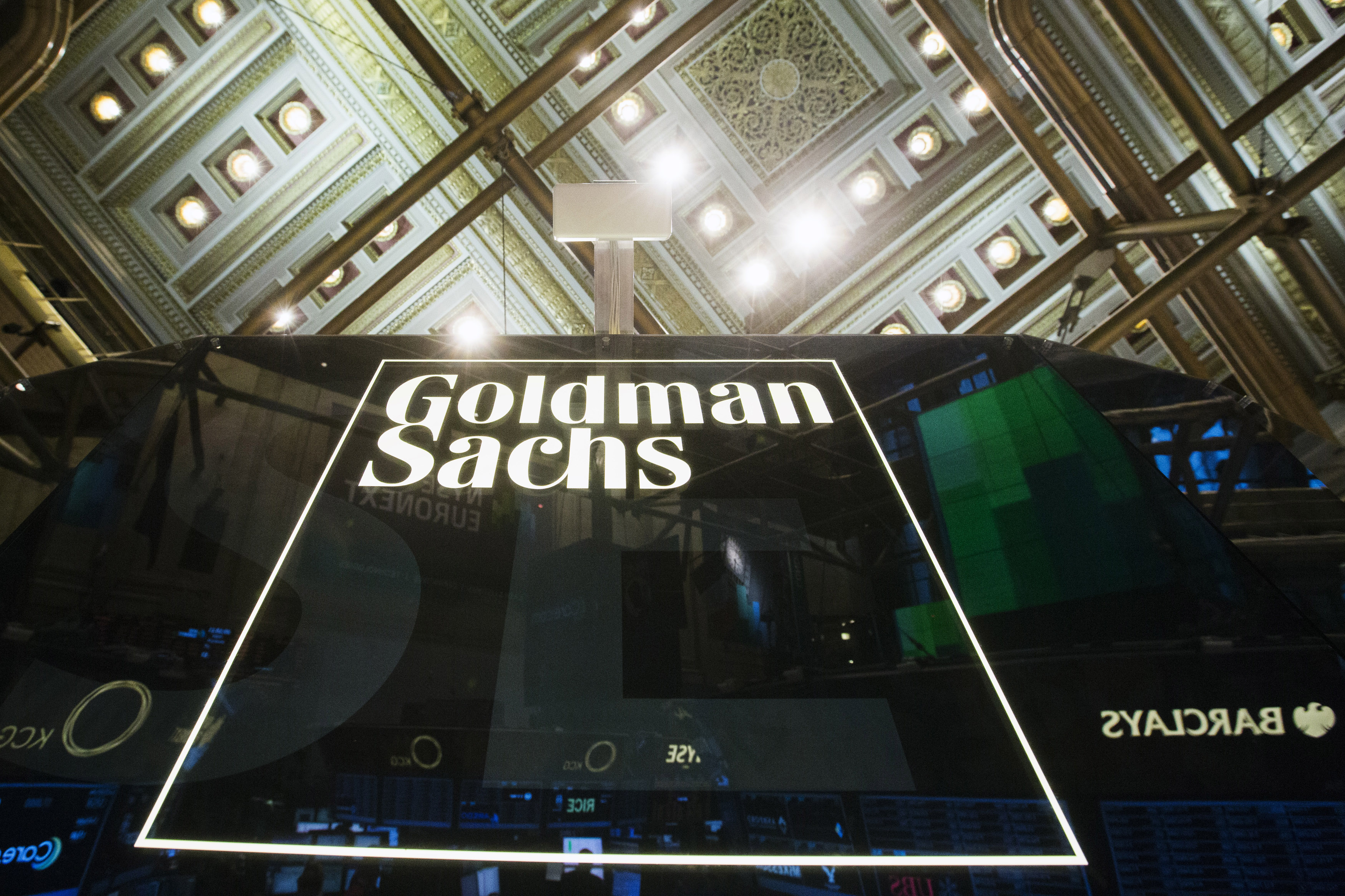 A Goldman Sachs sign is seen above the floor of the New York Stock Exchange shortly after the opening bell in the Manhattan borough of New York January 24, 2014.  REUTERS/Lucas Jackson (UNITED STATES - Tags: BUSINESS) - RTX17T1D