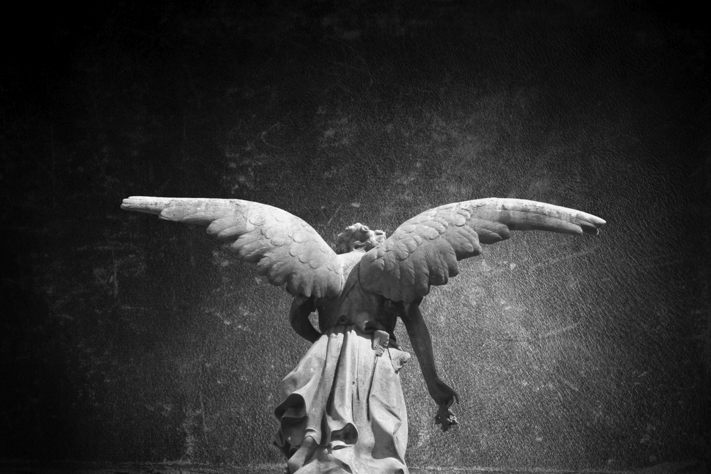 Angel sculpture in the Recoleta public cemetery in Buenos Aires, Argentina.