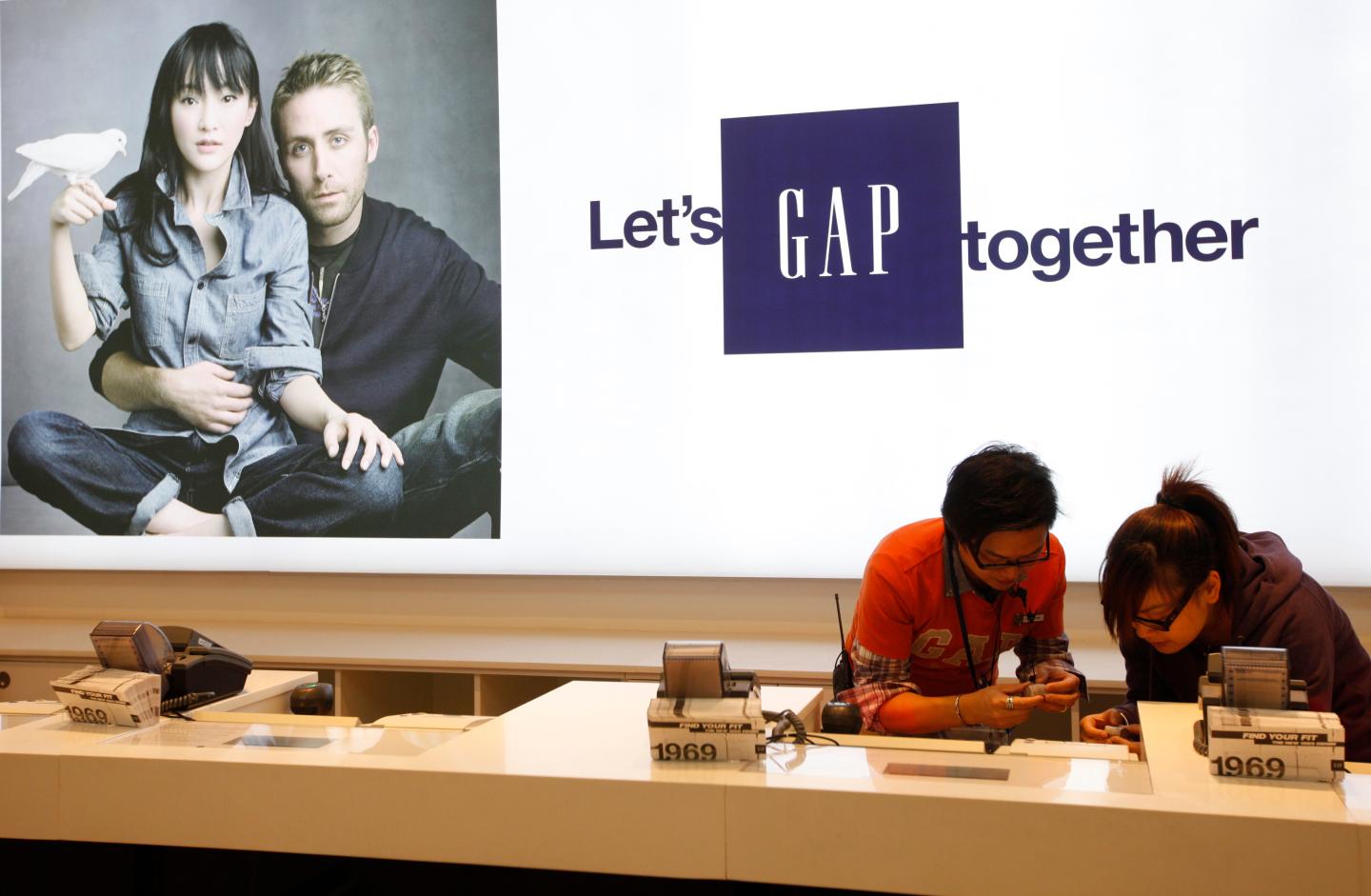 Gap sales assistants make last minute preparation at Hong Kong's first Gap Store before its opening in the financial Central district