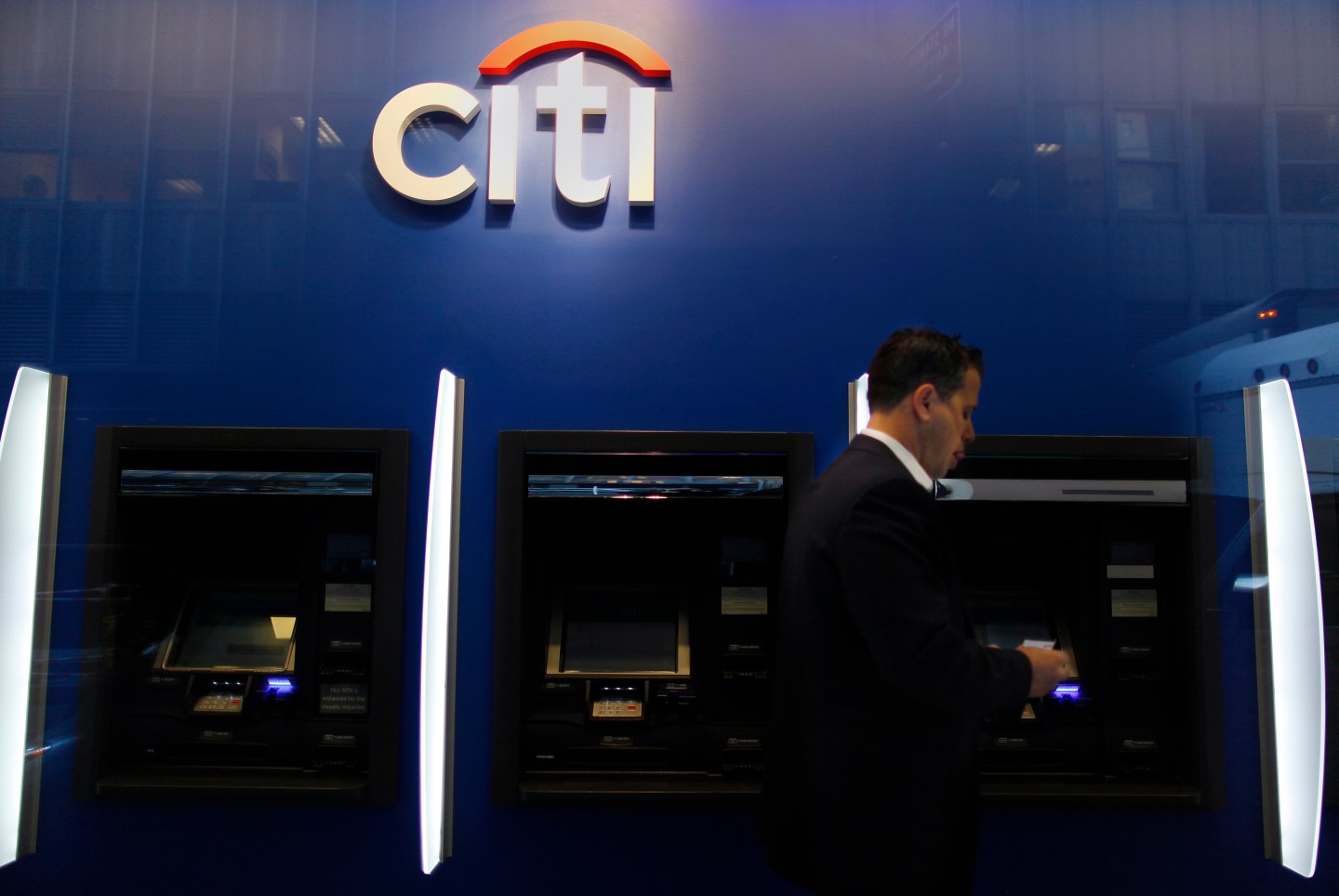 A man walks past a Citibank branch in lower Manhattan, New York