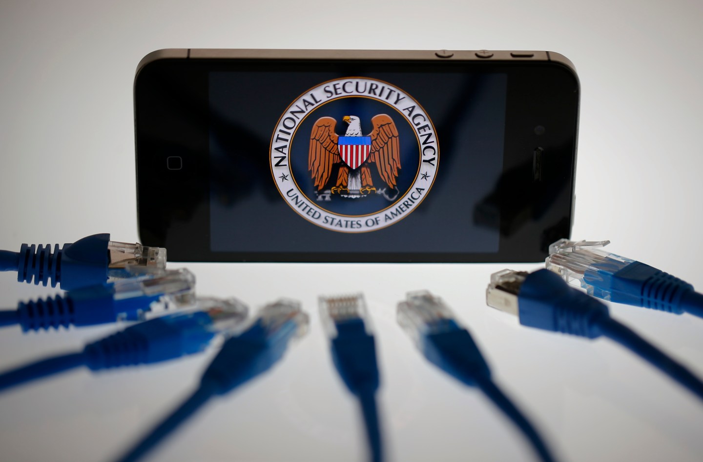 An illustration picture shows the logo of the U.S. National Security Agency on the display of an iPhone in Berlin