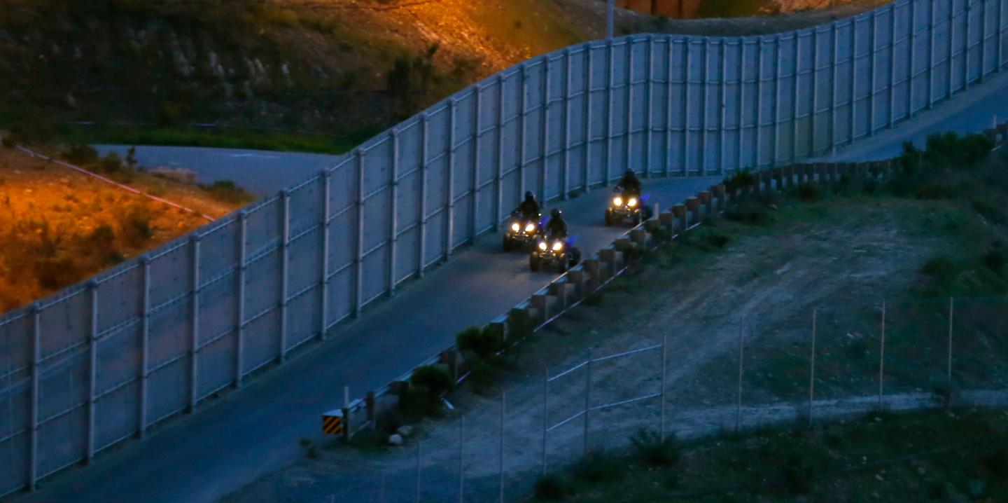 U.S. Border Patrol agents patrol along the international border between Mexico and the United States near San Diego