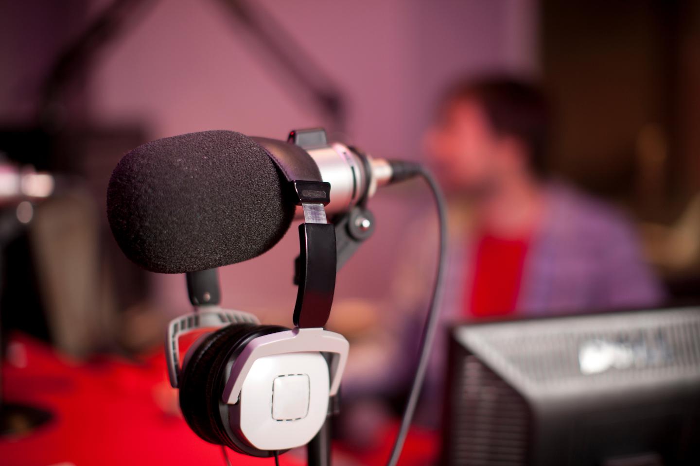 Microphone and headphones in recording studio
