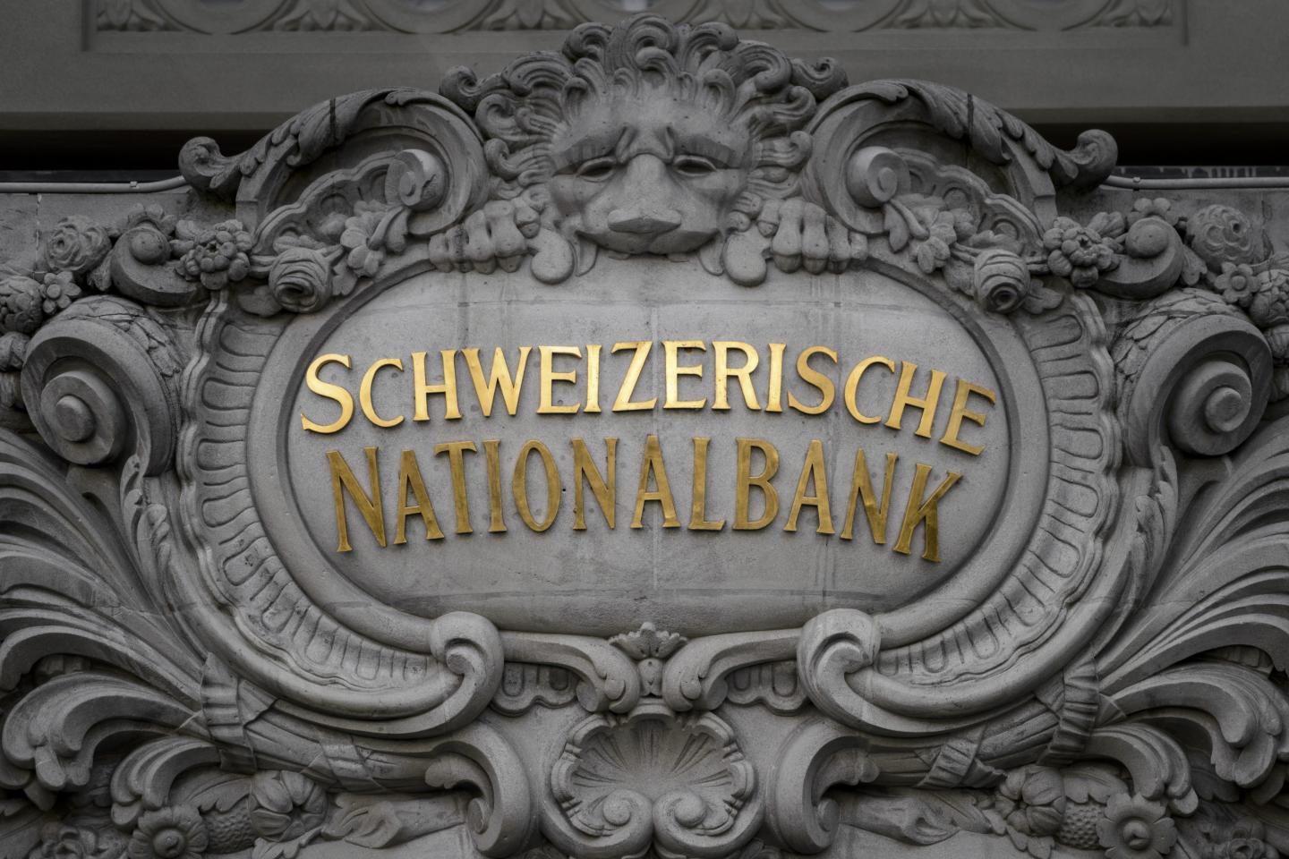 As the Fed inches toward rate hike, Switzerland goes negative