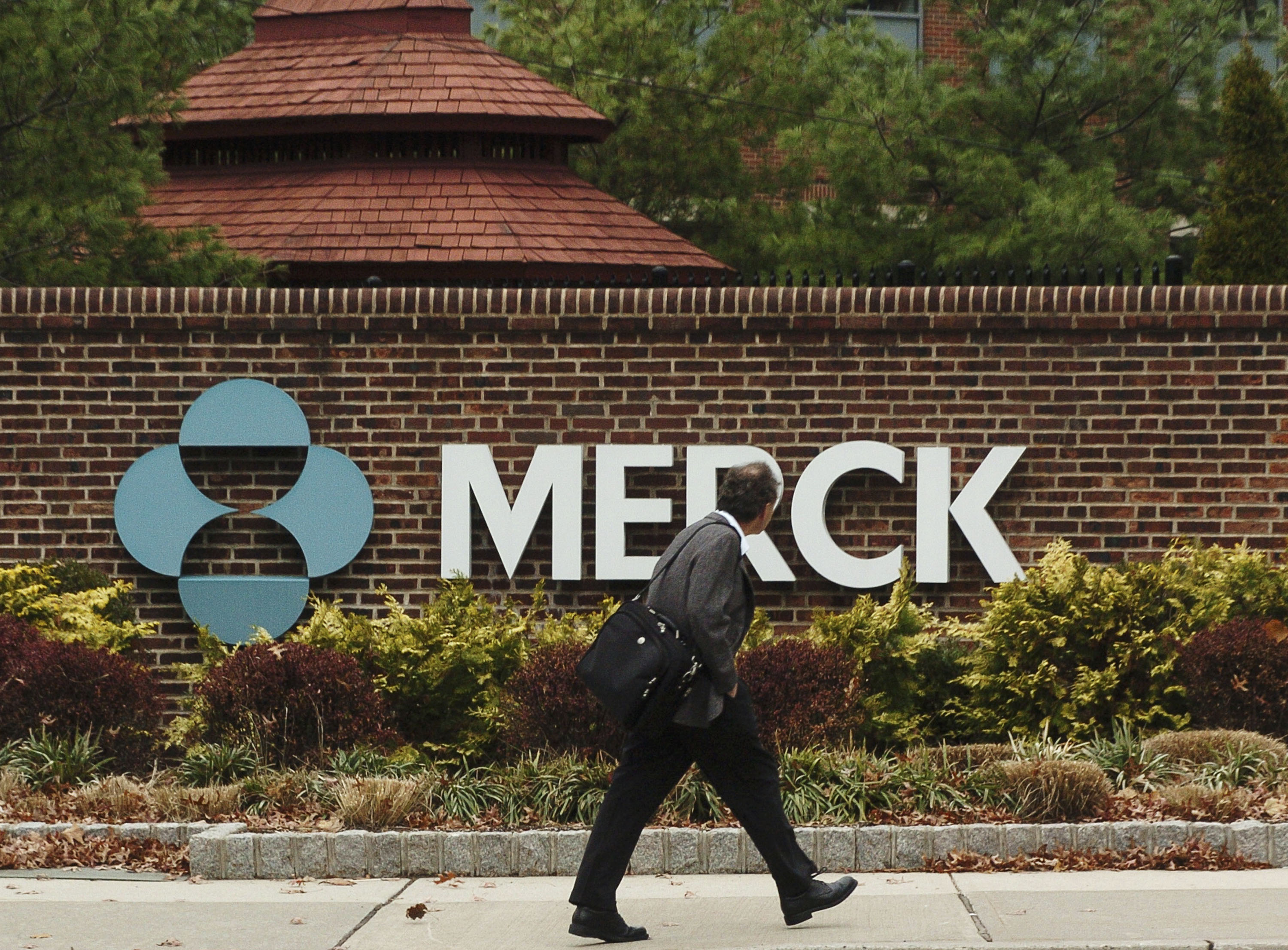 RAHWAY, NJ - NOVEMBER 29:  A man walks by a sign at a Merck plant November 29, 2005 in Rahway, New Jersey. U.S. pharmaceutical giant Merck, announced plans to cut some 7,000 jobs, or 11 percent of its global workforce, by the end of 2008. (Photo by Marko Georgiev/Getty Images)
