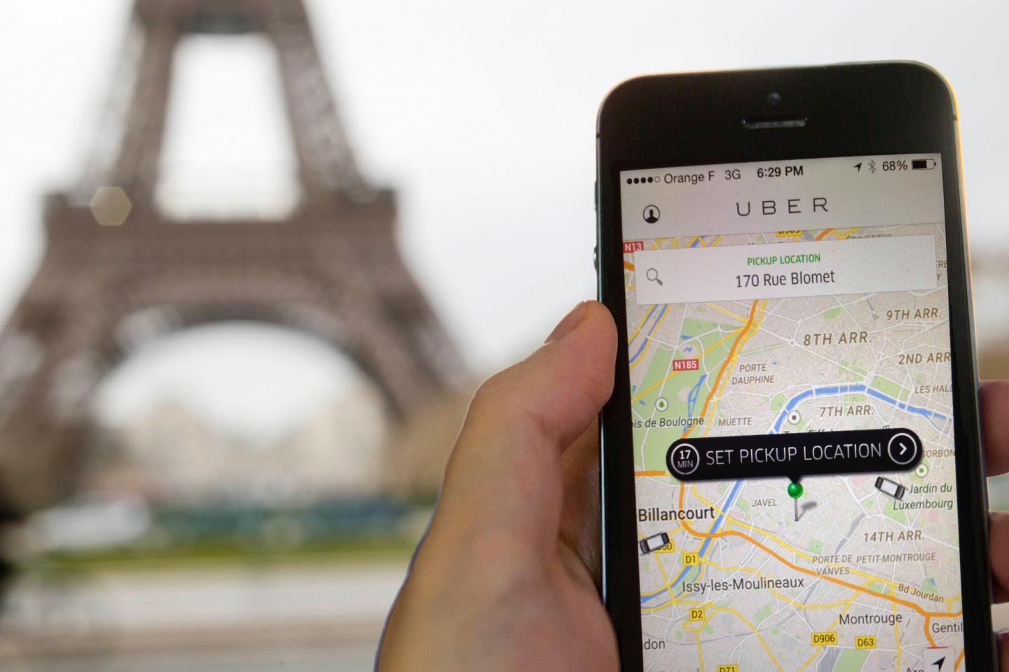 The Eiffel Tower seen on the screen of a cellphone in Paris,