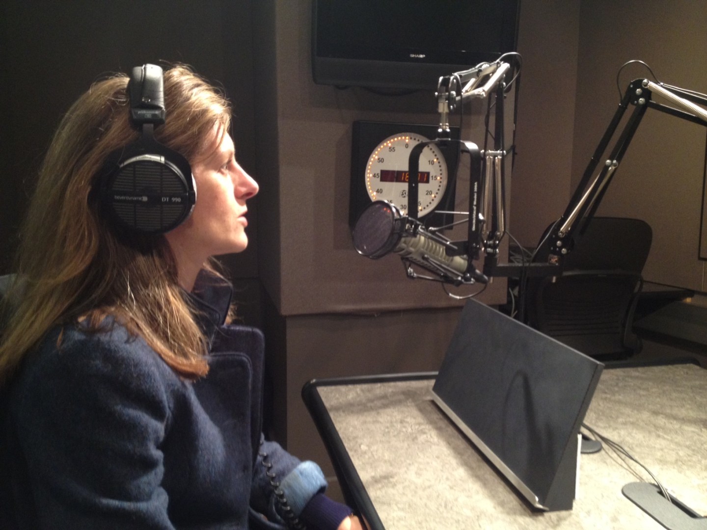 Ashley Milne-Tyte recording in a studio.
