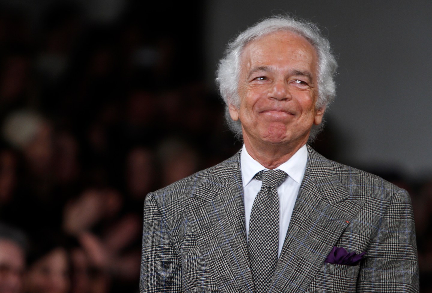 Designer Ralph Lauren acknowledges the crowd following the Fall/Winter 2012 collection during New York