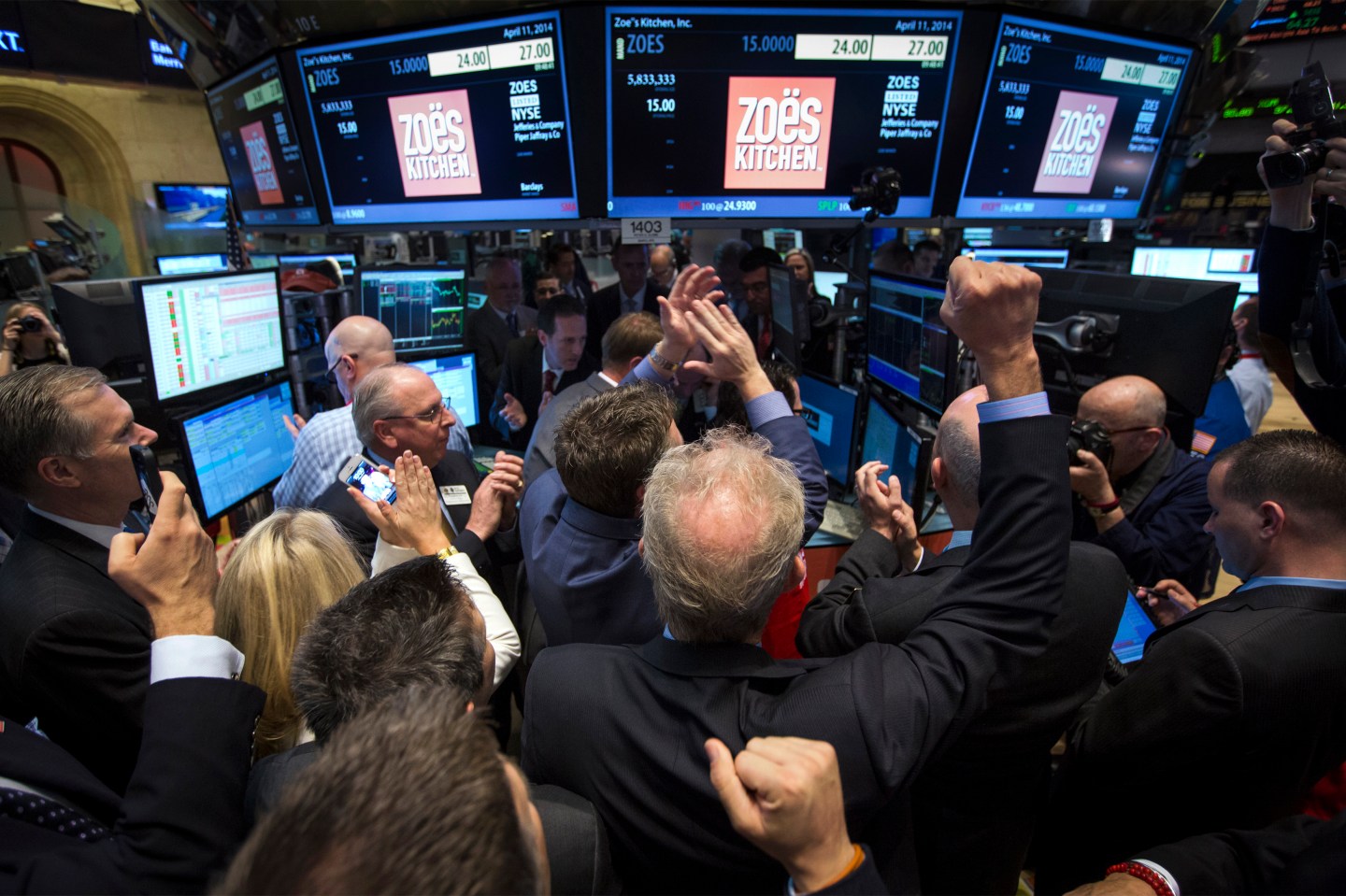 Traders, investors and guests celebrate as Zoe's Kitchen begins trading following the company's IPO at the NYSE