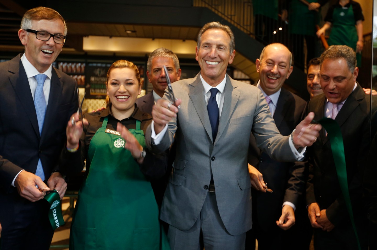 CEO of Starbucks Howard Schultz smiles after inaugurating the coffee chain's first Colombian store at 93 park in Bogota